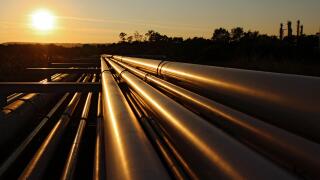 golden steel pipeline system during sunset