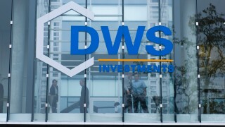 Investment bankers behind a glass pane of DWS Investments, Frankfurt, Germany, Europe