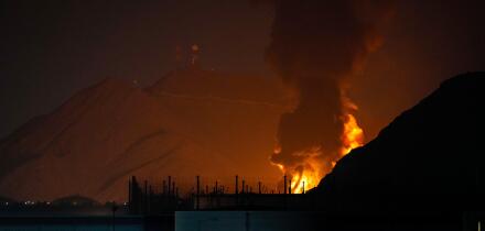 Large fire and plume of smoke is visible after, according to the authorities, debris of an Iranian intercepted drone hit the Fujairah oil facility, in Fujairah, United Arab Emirates, Tuesday, March 3, 2026. (AP Photo/Altaf Qadri)