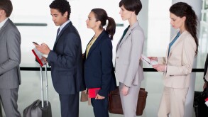 Business people standing in queue at airport