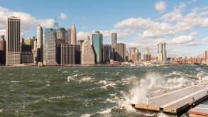 The windy, choppy waters of the East River break against a breakwater in Brooklyn Bridge Park in New York on Sunday, October 23, 2016. Wind gusts reached 55 mph with the city issuing a wind advisory. Monday is expected to be warmer with less wind. (©&nbsp;Rich