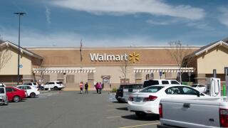 Wallmart store front Dixon, California, USA, on a cloudless sky day, and custommers walking about