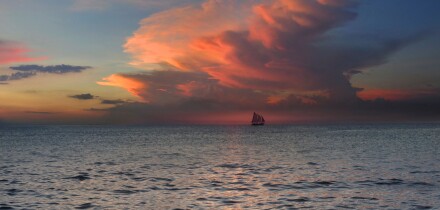 View of sloop on the horizon at sunset, Boracay, Philippines, Asia