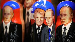 Traditional Russian wooden dolls, called Matryoshka, depicting Republican presidential nominee an former US President Donald Trump, center left, and Russian President Vladimir Putin are displayed for sale at a souvenir shop in St. Petersburg, Russia, Tues