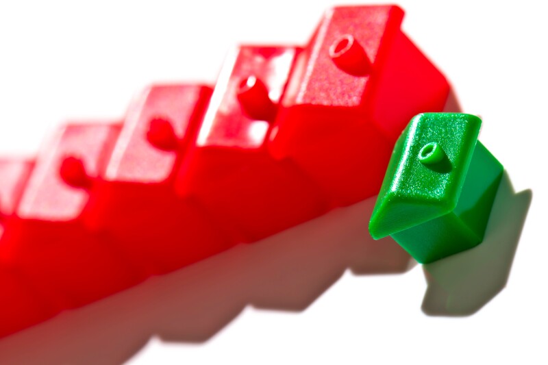 Monopoly style houses on a white background with room for type