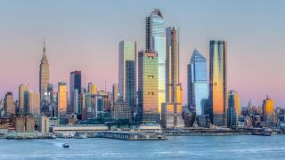 The mixed-use Hudson Yards real estate development and other buildings on the West Side of Manhattan in New York City at sunset.
