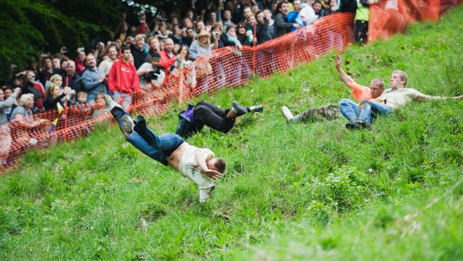 Rollover risk in action at the Cheese Rolling Festival, Cooper's Hill, Gloucestershire, UK