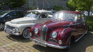 Two vintage cars in red and white parked next to each other in the shade, vintage car, Volvo PV 544, 1964, and BMW 502, 2600 L, 1962, Lower Saxony, Ge