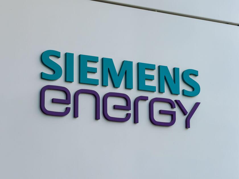 Siemens Energy logo sign close-up. Technology and engineering company which is a big employer in the industry. Symbol on the building facade.