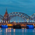 Night river with bridge and reflection in Riga