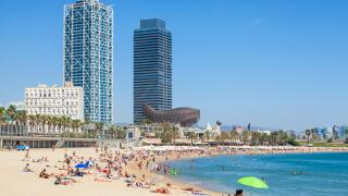 People sunbathing on Barcelona beach, Barceloneta, Barcelona, Catalonia (Catalunya), Spain, Europe