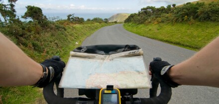 A GPS and map on a bicycle tour along the coast of Exmoor near hunters inn, Devon