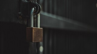 Closeup steel door with lock , padlock , key lock , dark background