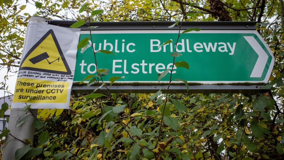 Public Bridleway sign near Elstree, Hertforshire, with notice about CCTV to deter fly-tipping