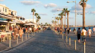 Tourists on the promenade in Kato Paphos, Paphos, Cyprus