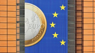 Banner about the euro hanging from building of the European Commission, executive body of European Union in Brussels, Belgium