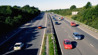 Traffic in the early morning light on the M4 in South Wales UK GB