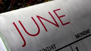 A calendar page for the month of June, displaying the dates and a visual design related to the season. The page reflects the arrival of summer with bright colors or summer-themed images.