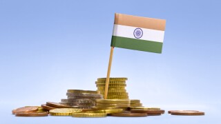 Flag of India in a stack of coins-adobe-2022