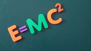 The famous theory of relativity shown on a chalkboard symbolizes education.