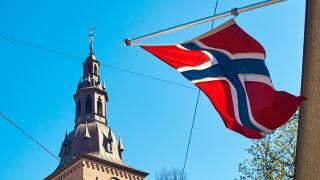 Norwegin flag waving on a sunny spring day in Oslo, Norway