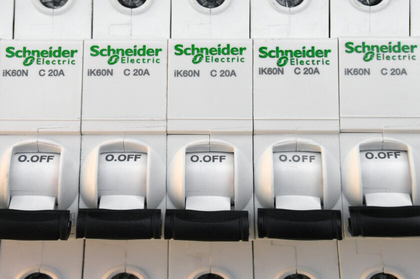 Schneider electric circuit breakers on white background.