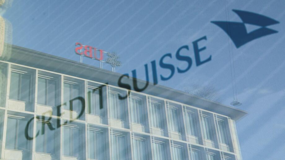 Logos of Swiss banks UBS and Credit Suisse are seen in Zurich, Switzerland March 20, 2023. REUTERS/Denis Balibouse