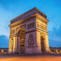 Paris France city skyline night at Arc de Triomphe and Champs Elysees empty nobody