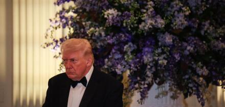 Washington, United States Of America. 21st Feb, 2026. United States President Donald J Trump lowers his head in prayer during the Governors Dinner in the East Room of the White House on February 21, 2025 in Washington, DC Credit: Samuel Corum/Pool via CNP