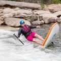 Stand up paddleboarder falling in white water. Image shot 09/2014. Exact date unknown.