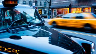 A typical taxi driving through New York, a London taxi parked on the roadside, New York City, NY, USA