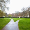 Grosvenor Square, London, W1.  A path diverging - becoming two narrow paths - each going in different directions. UK.
