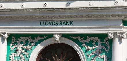 Detail of the decorative exterior of the Lloyds Bank branch on the high street in Guildford, Surrey, UK
