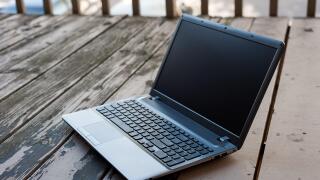 Laptop on the wooden table