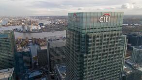 UK headquarters of CITI bank at 25 Canada Square, Canary Wharf, London, with the O2 arena and River Thames in the background.