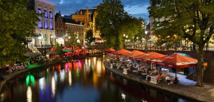 Bars and restaurants along Oudegracht canal come alive at night in Utrecht
