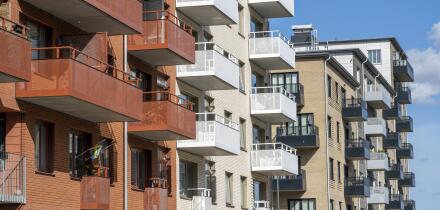 Red and white apartment blocks with many balconies in Berlin, Germany, Europe