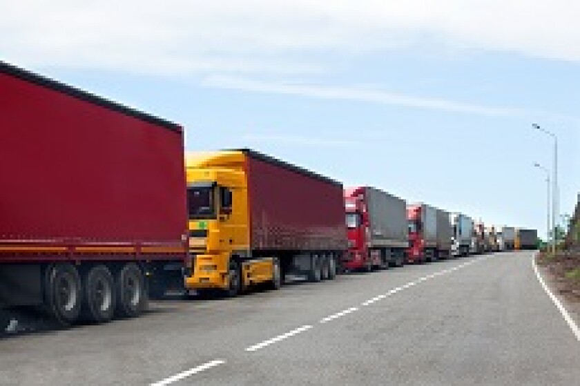 Queue lorries traffic jam border trade from Adobe 230x150