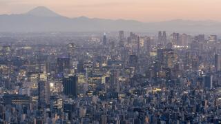 An aerial view of the Tokyo skyline at sunset.