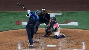 National League's Shohei Ohtani, of the Los Angeles Dodgers, hits a home run during the third inning of the MLB All-Star baseball game, Tuesday, July 16, 2024, in Arlington, Texas. Jurickson Profar, of the San Diego Padres, and Ketel Marte, of the Arizona