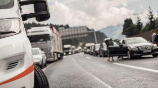 Typical scene on European highways during summer holiadays rush hour. A traffic jam with rows of cars tue to highway car accident. Empty emergency
