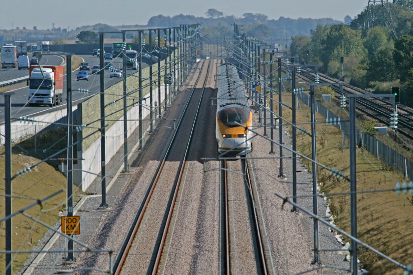 Eurostar speeds through a congested 'pinch point' with the M20 motorway and domestic rail line on the Channel Tunnel Rail Link.