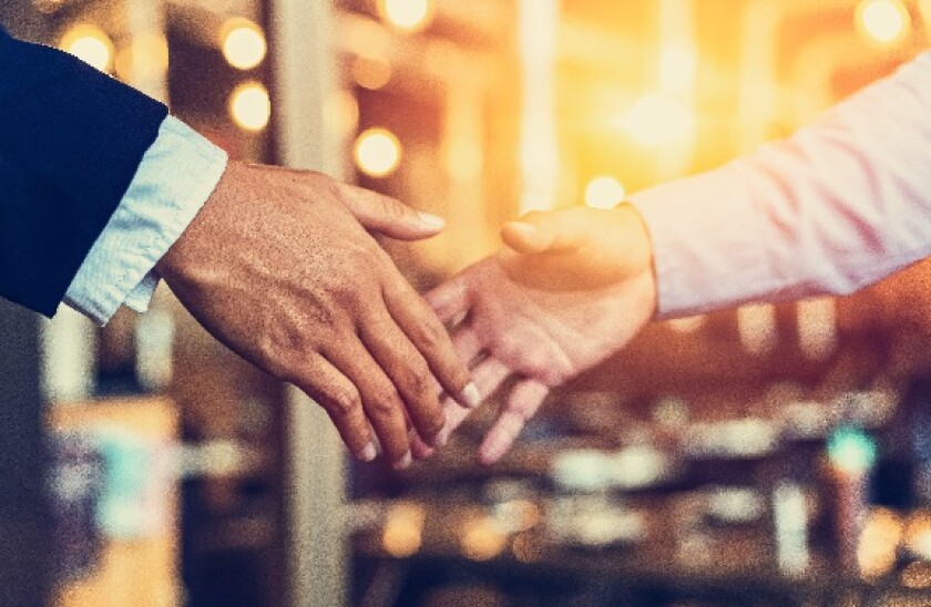 Businessmen making handshake, finishing up a meeting