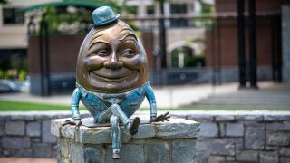 Humpty Dumpty statue sitting on wall in Suwanee Town Square, Suwanee, Georgia