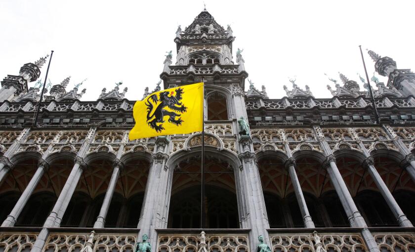 The Flemish community flag is seen at Brussels' Grand Place as part of celebrations of the Flemish community day July 11, 2008. REUTERS/Francois Lenoir (BELGIUM)