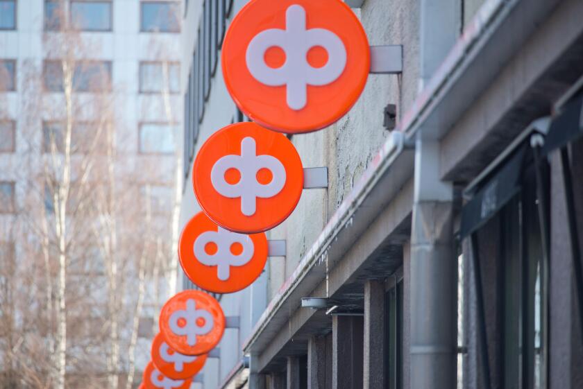 Osuuspankki signs on Hallituskatu street in Oulu, Finland