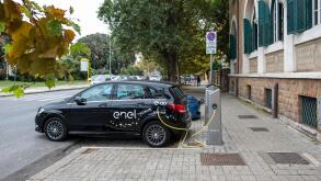 Electric Mercedes-Benz of E-Go car share service recharging on Enel X charging station in Ostia, a neighbourhood of Rome.