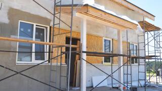 House entrance under painting, plastering and constuction outdoor.