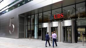 Entrance of 5 Broadgate UBS building exterior HQ headquarters sign people  financial services investment bank in the City of London UK   KATHY DEWITT
