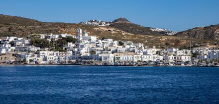 View from the sea to the town of Adamas with Plaka on a hill in the distance, Adamas, Milos, South Aegean, Greece, Europe